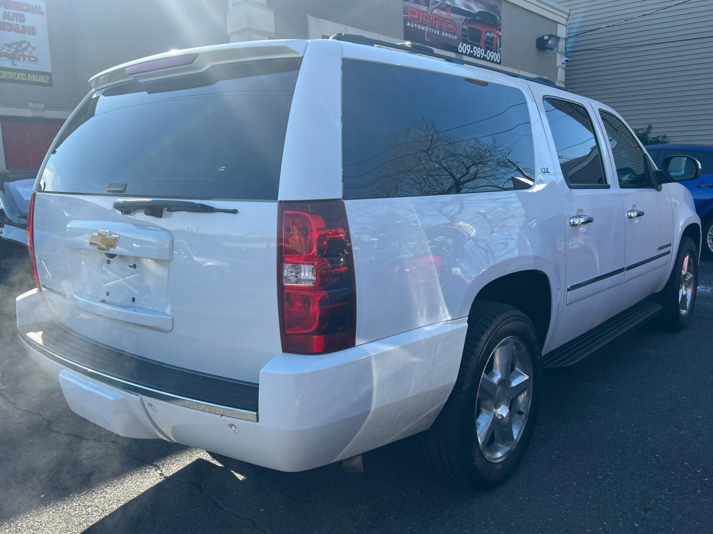 2014 White /Black Leather Chevrolet Suburban LTZ 1500 4WD (1GNSKKE77ER) with an 5.3L V8 OHV 16V FFV engine, 6 SPEED AUTOMATIC transmission, located at 1018 Brunswick Ave, Trenton, NJ, 08638, (609) 989-0900, 40.240086, -74.748085 - Photo#3